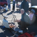 Danny checks the meat with Julia watching over the process