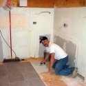 The flooring installation begins