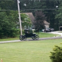 A parade of antique American automobiles