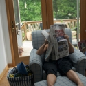 Amy reads the paper