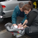 Mommy & Daddy get her ready for the car