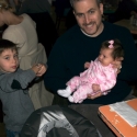 Cousin Max shows Uncle Daniel and Cousin Sara his new wrist watch