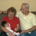 Bubbie, Grandpa and Sara together on the sofa