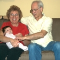 Bubbie, Grandpa and Sara together on the sofa