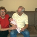 Bubbie, Grandpa and Sara together on the sofa