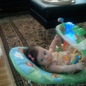 In her soon to arrive friend's bouncy seat!