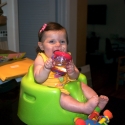 Sitting in her new bumbo seat, watching daddy cook!