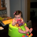 Sitting in her new bumbo seat, watching daddy cook!