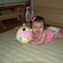 Playing on the carpet in her room