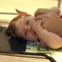 Sara and Daddy playing on the boardwalk in Coney Island