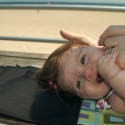 Sara and Daddy playing on the boardwalk in Coney Island