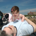 Sara and Daddy playing on the boardwalk in Coney Island