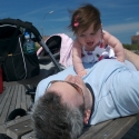 Sara and Daddy playing on the boardwalk in Coney Island