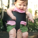 Sara giggles as she swings