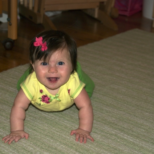 Playing on her rug