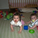 Sara and Grant play on the carpet