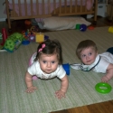 Sara and Grant play on the carpet