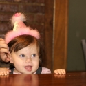 The birthday girl awaits her cake!