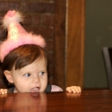 The birthday girl awaits her cake!