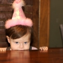 The birthday girl awaits her cake!