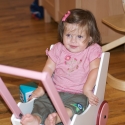 Playing in her cart