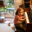 At Aunt Gorgeous's house, Sara tickles the ivories