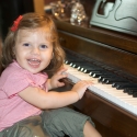 At Aunt Gorgeous's house, Sara tickles the ivories