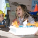 Birthday boy blows out the candles