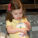 Helping Mommy pack up the bottles