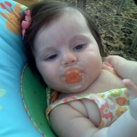 In her soon to arrive friend's bouncy seat!